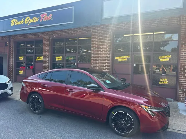 Nissan Sentra with ceramic tint and gloss black roof wrap at the Short Pump shop